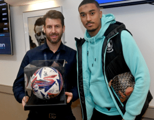 Nick Bass presenting Man of the Match Award to Yan Valery